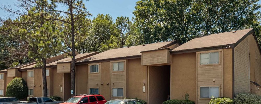 Pheasant Run Apartment Building Exterior and Parking Lot
